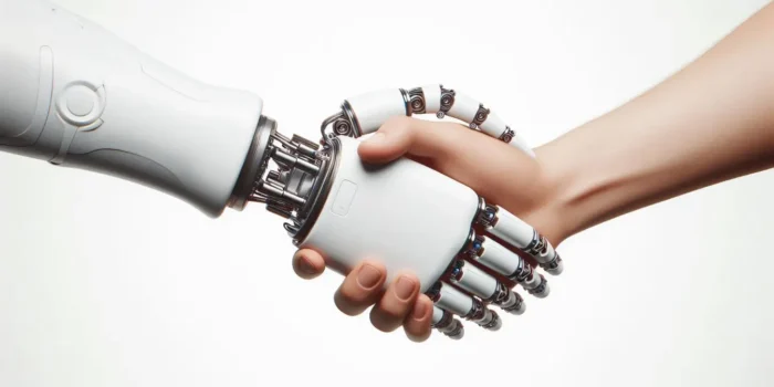 A white robotic hand shaking hands with a human hand symbolizing custom CRM development.